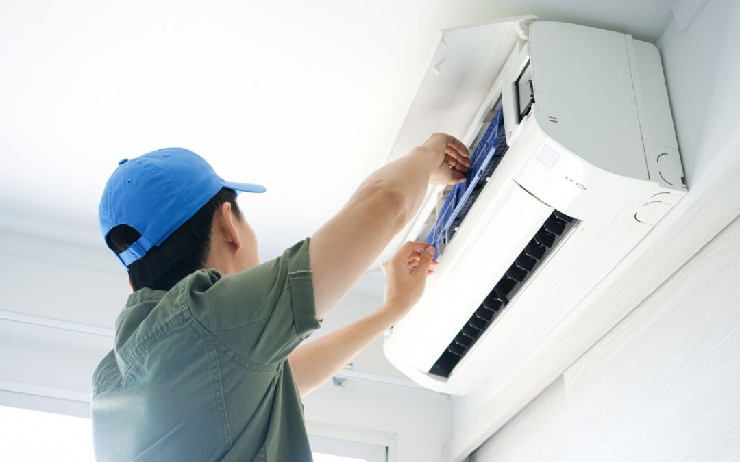 HVAC technician servicing a ductless mini split in Carson
